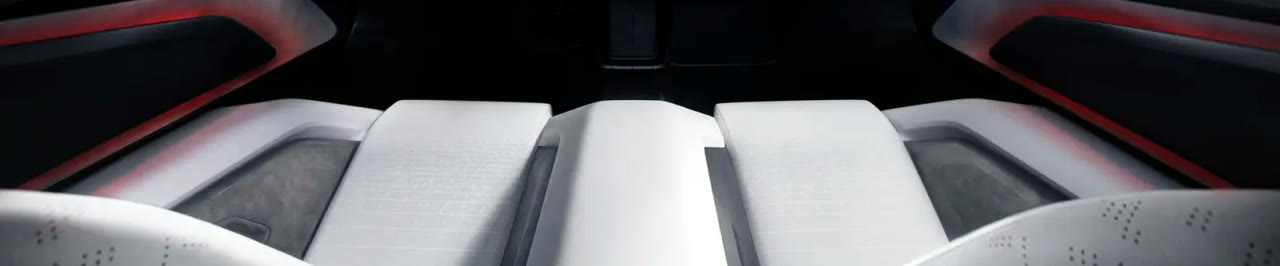 Sculpted seats and red ambient lighting